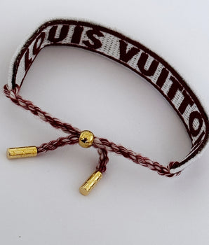 PULSERA LV TELA ROJA